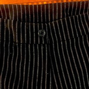 Black & white pinstripe pants with front zip closure